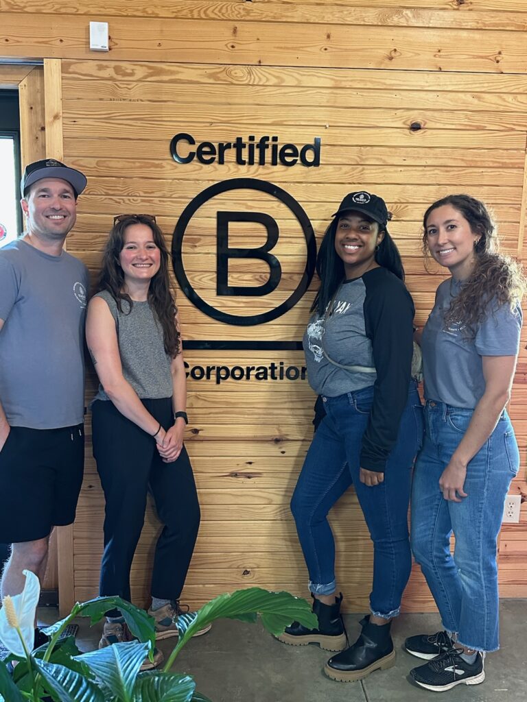 Group poses with B Corp logo