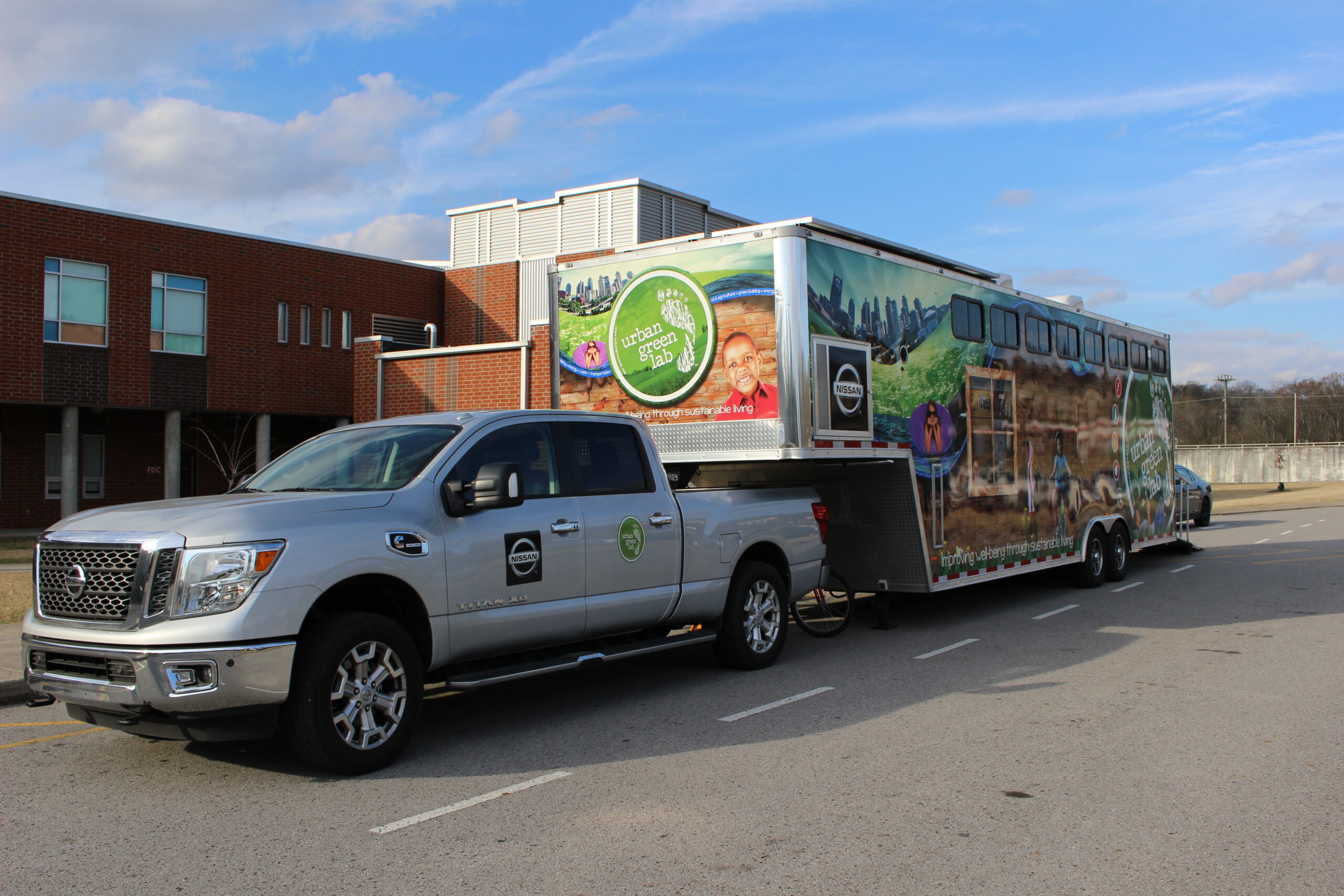 The Urban Green Lab Mobile Lab pulled by a Nissan Titan.