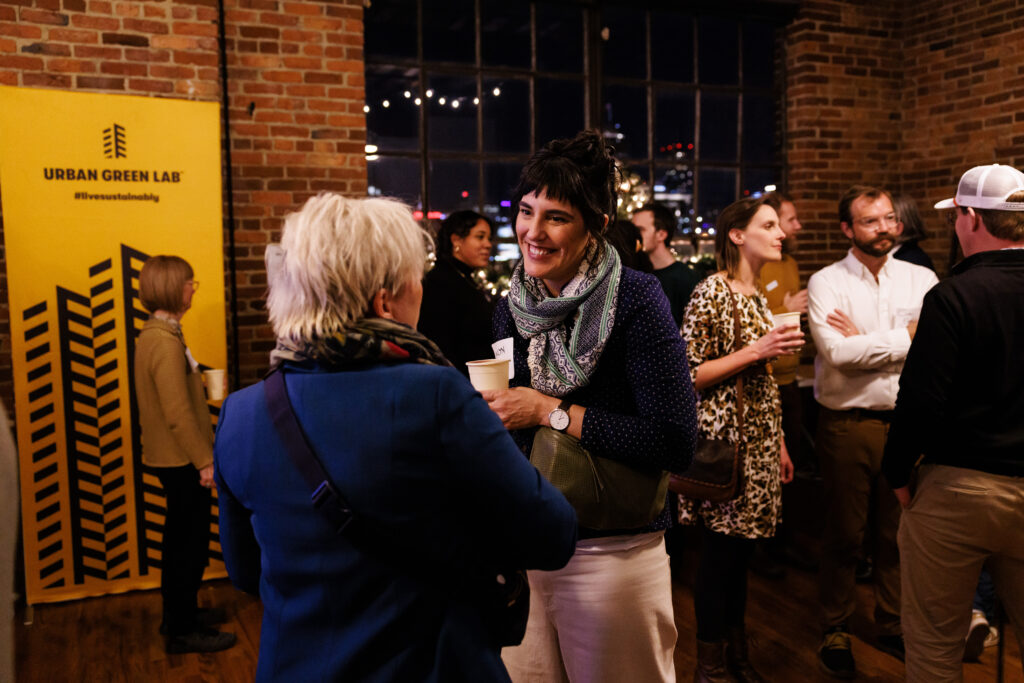 Two woman talk at a party