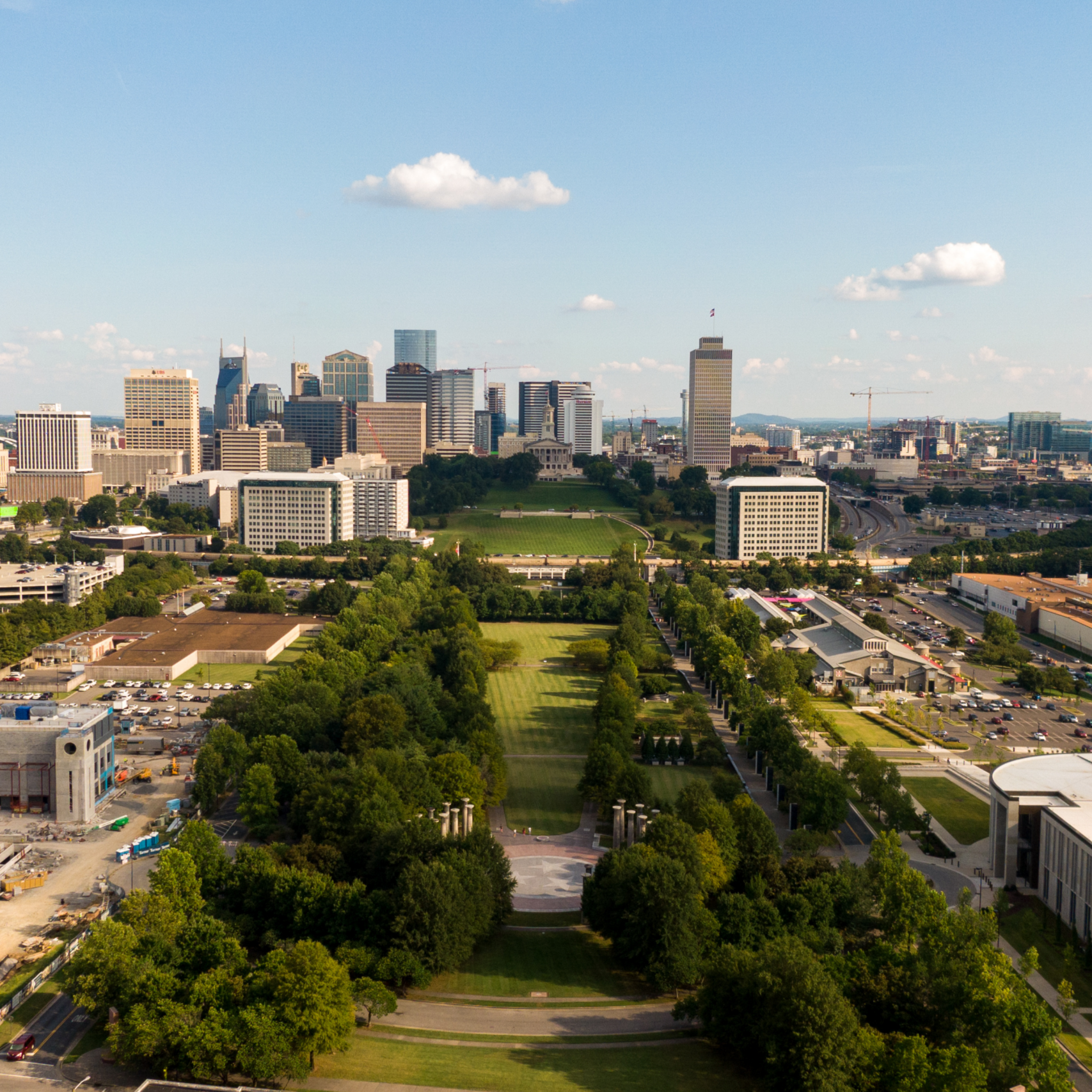 drone shot of bicentennial mall and downtown nashville skyline