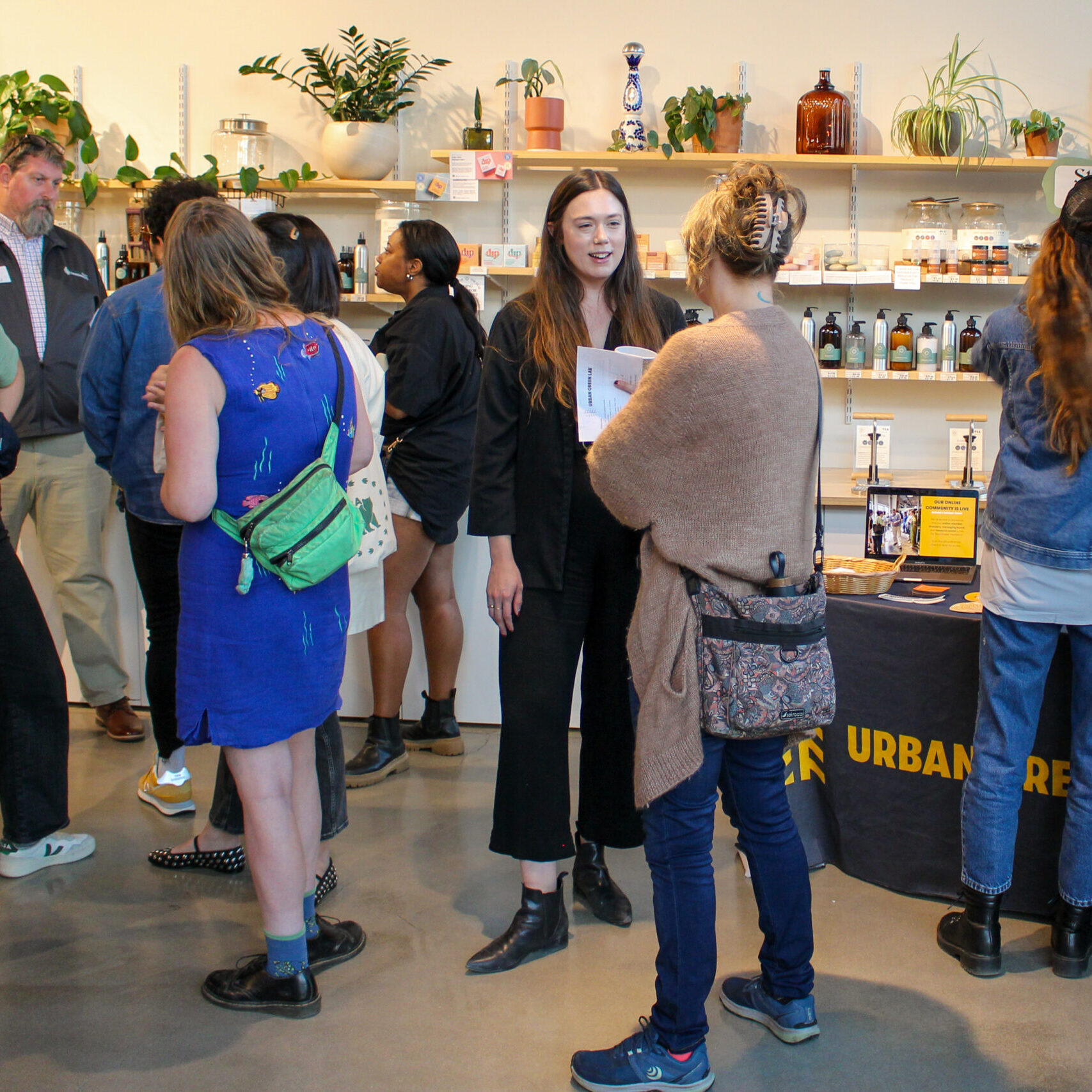 A group of people standing and networking at a Roundtable event