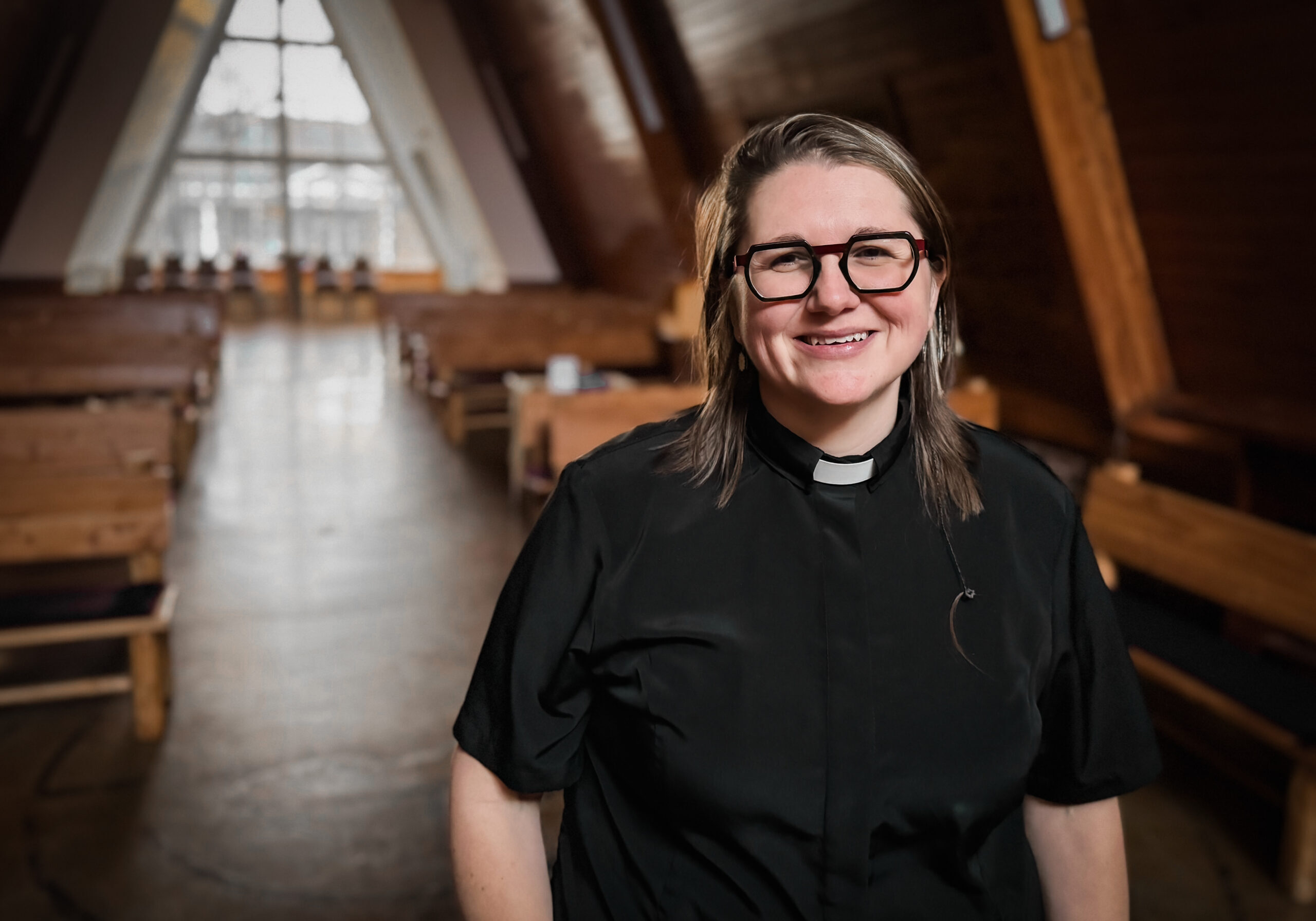 Portraiture Fields_Kate_021825_1 Reverend with indoor chapel behind her