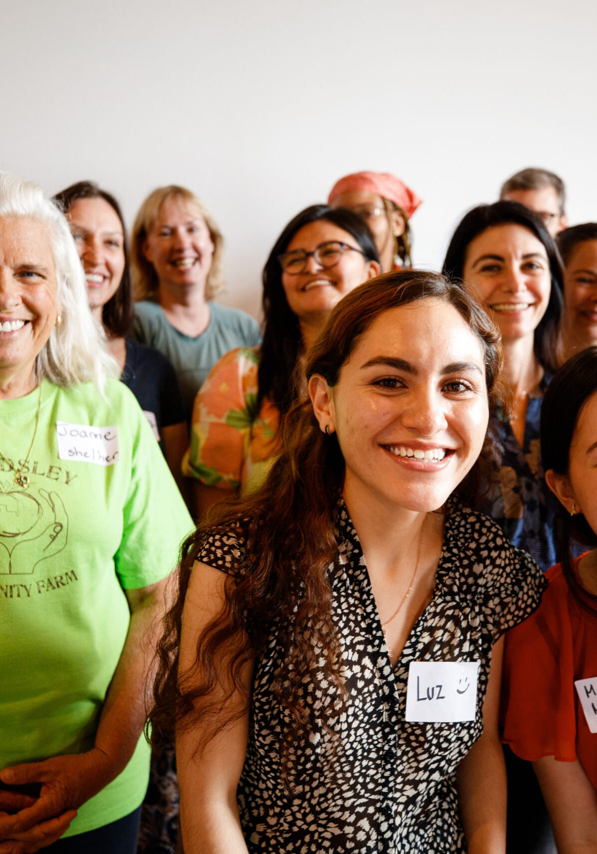 Group of people taking a group photo smiling at the camera