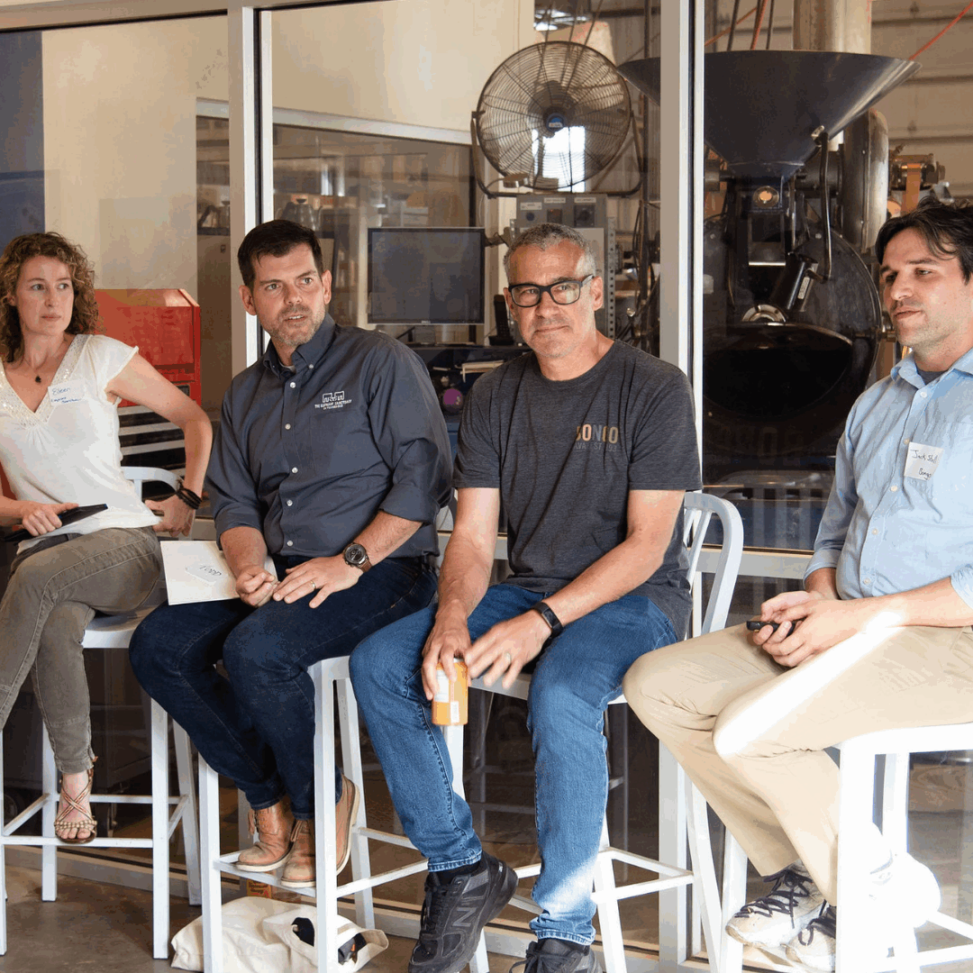 panel of people sitting in chairs